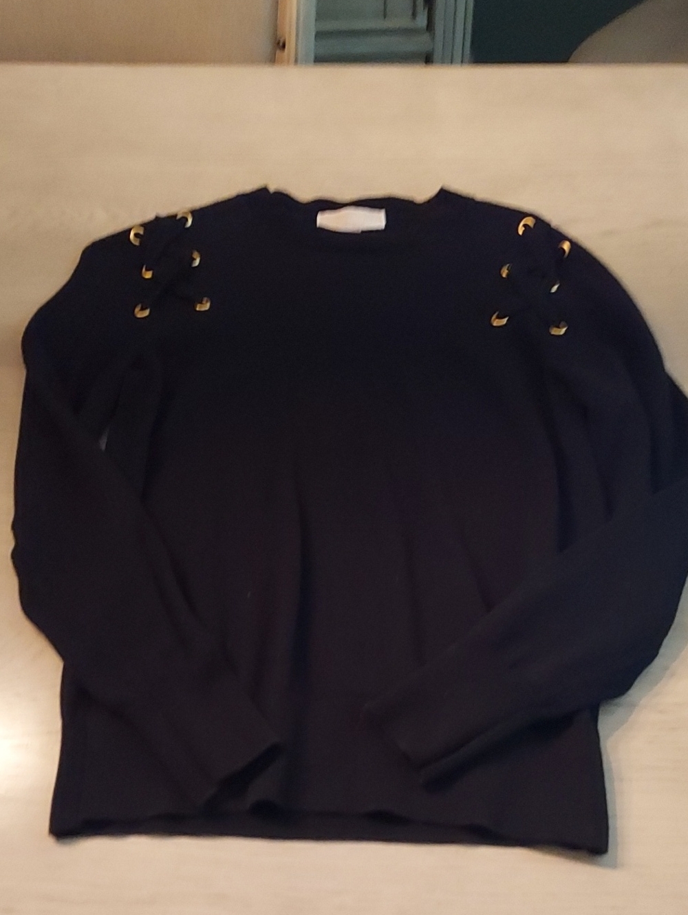 Michael Kors Ladies Classic Black Crewneck Sweater with Gold Eyelet Detail